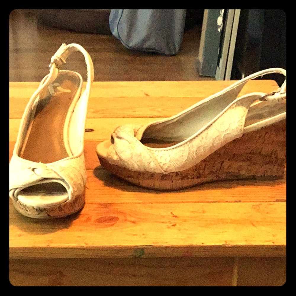 Cream open toed wedges.